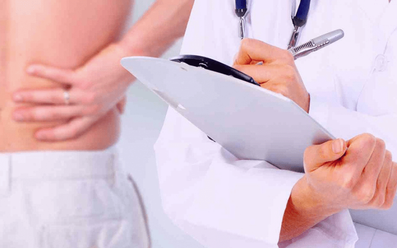 The doctor prescribes treatment for lower back pain